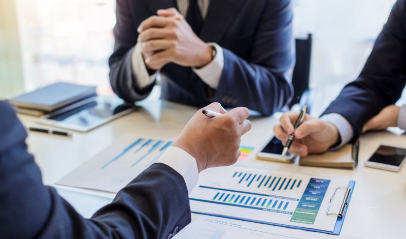 Group of business people meeting to discuss financial investment and marketing.